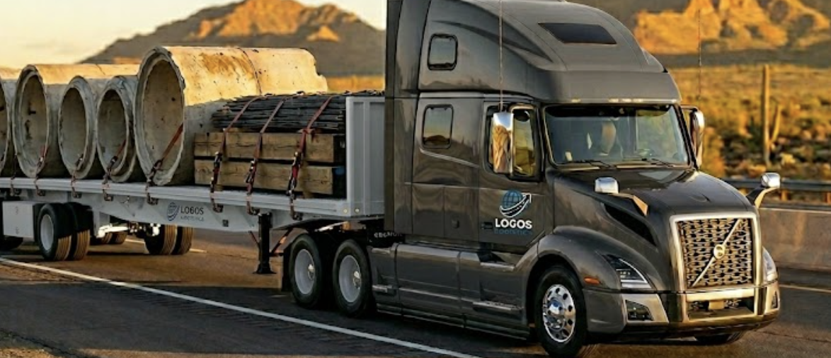 Flatbed semi hauling oversized freight on open road